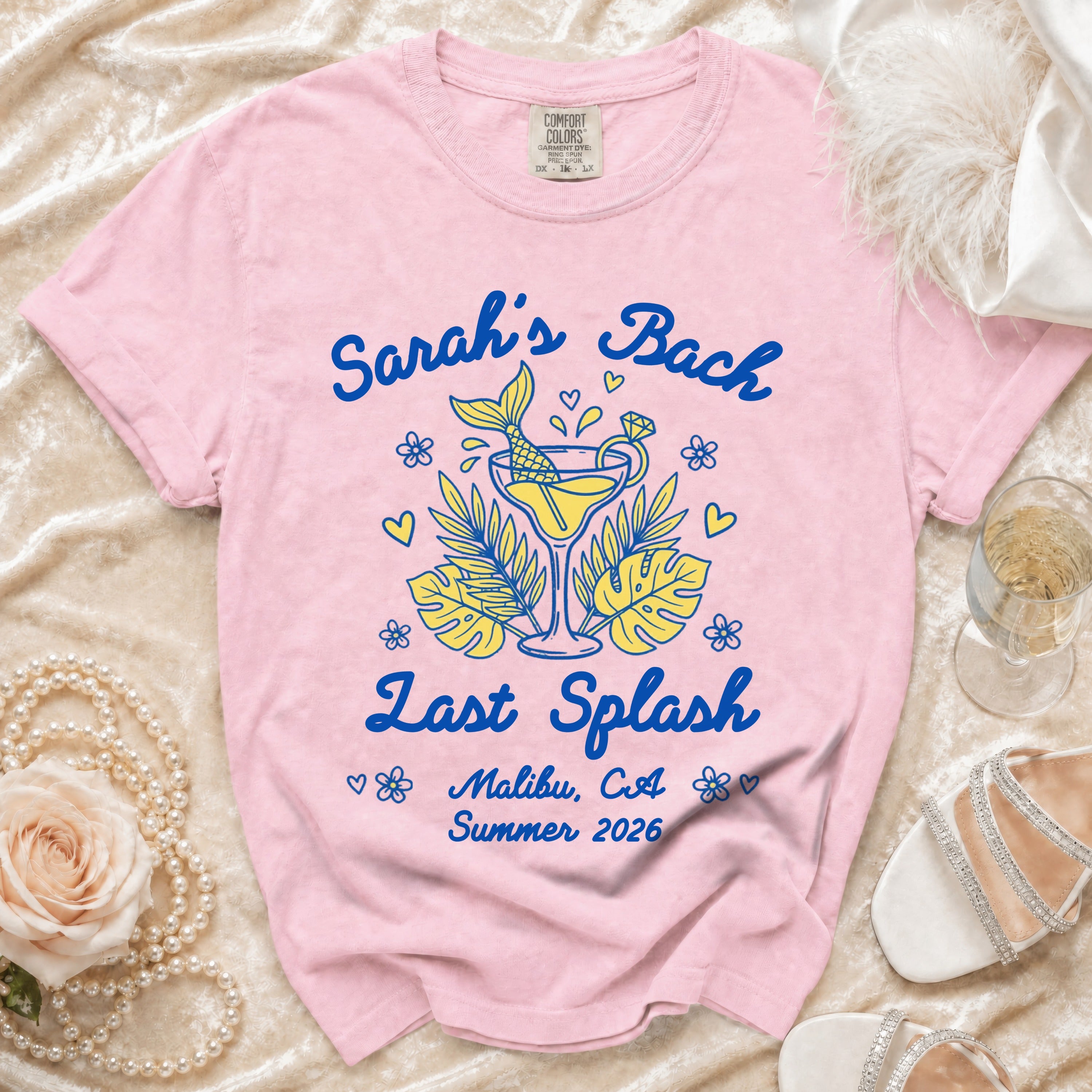 Pink t-shirt with "Sarah's Bach Last Splash Malibu, CA Summer 2026" and mermaid cocktail graphic.