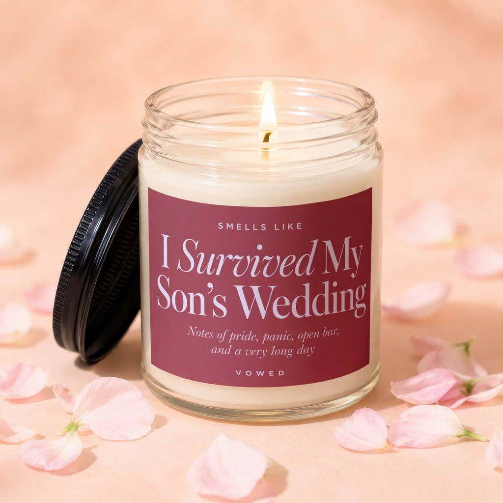 Jar candle with "I Survived My Son's Wedding" scent description and "VOWED".