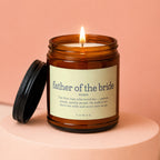 Amber jar candle labeled "father of the bride" with a definition and lit wick.