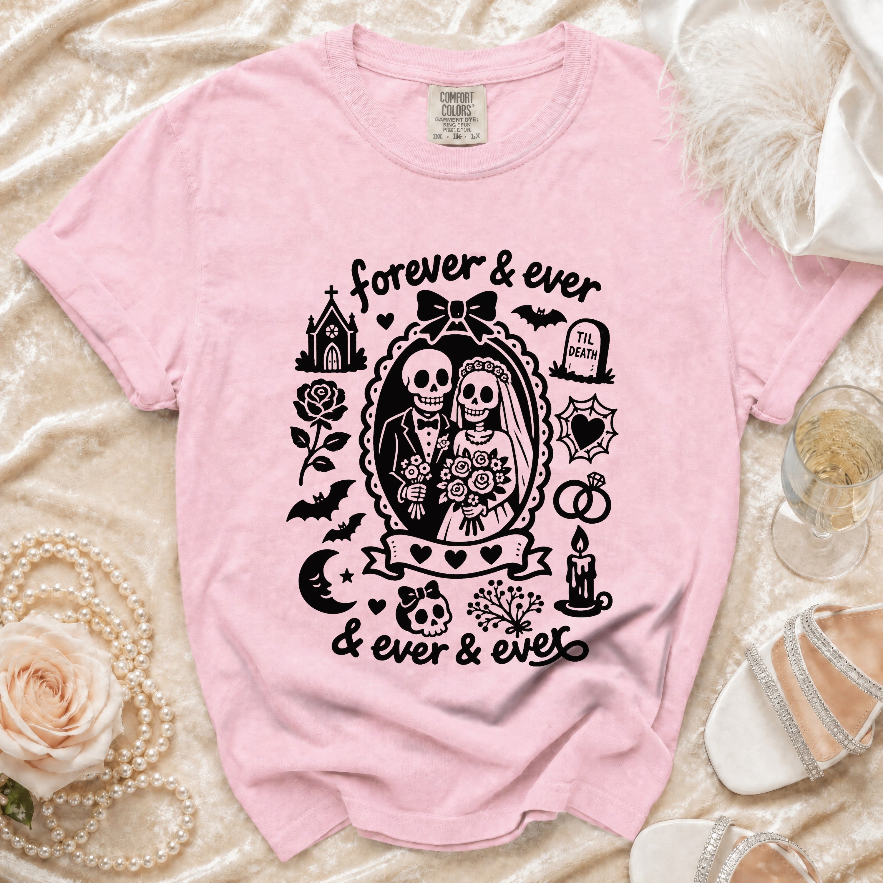 Pink t-shirt with black Halloween gothic wedding couple skeleton graphic and text.