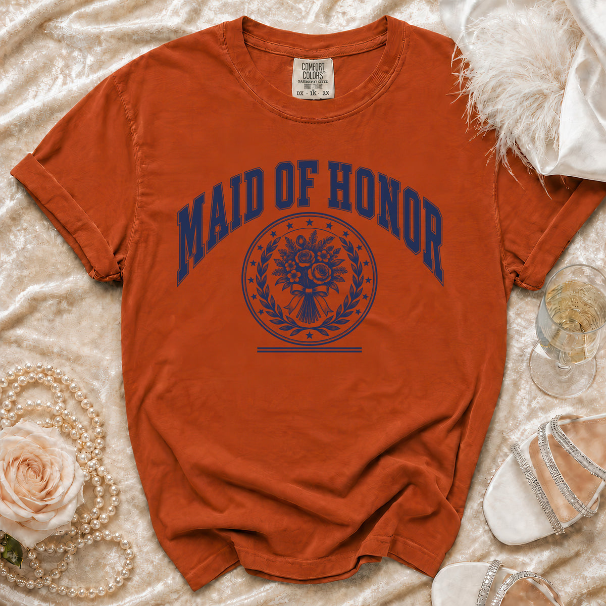 Orange t-shirt with "Maid of Honor" and floral design.