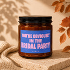 Brown candle with blue label reading "YOU'RE OBVIOUSLY IN THE BRIDAL PARTY"