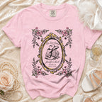 Pink t-shirt with cowboy boot, hat, and flowers; "Her Last Rodeo" text.