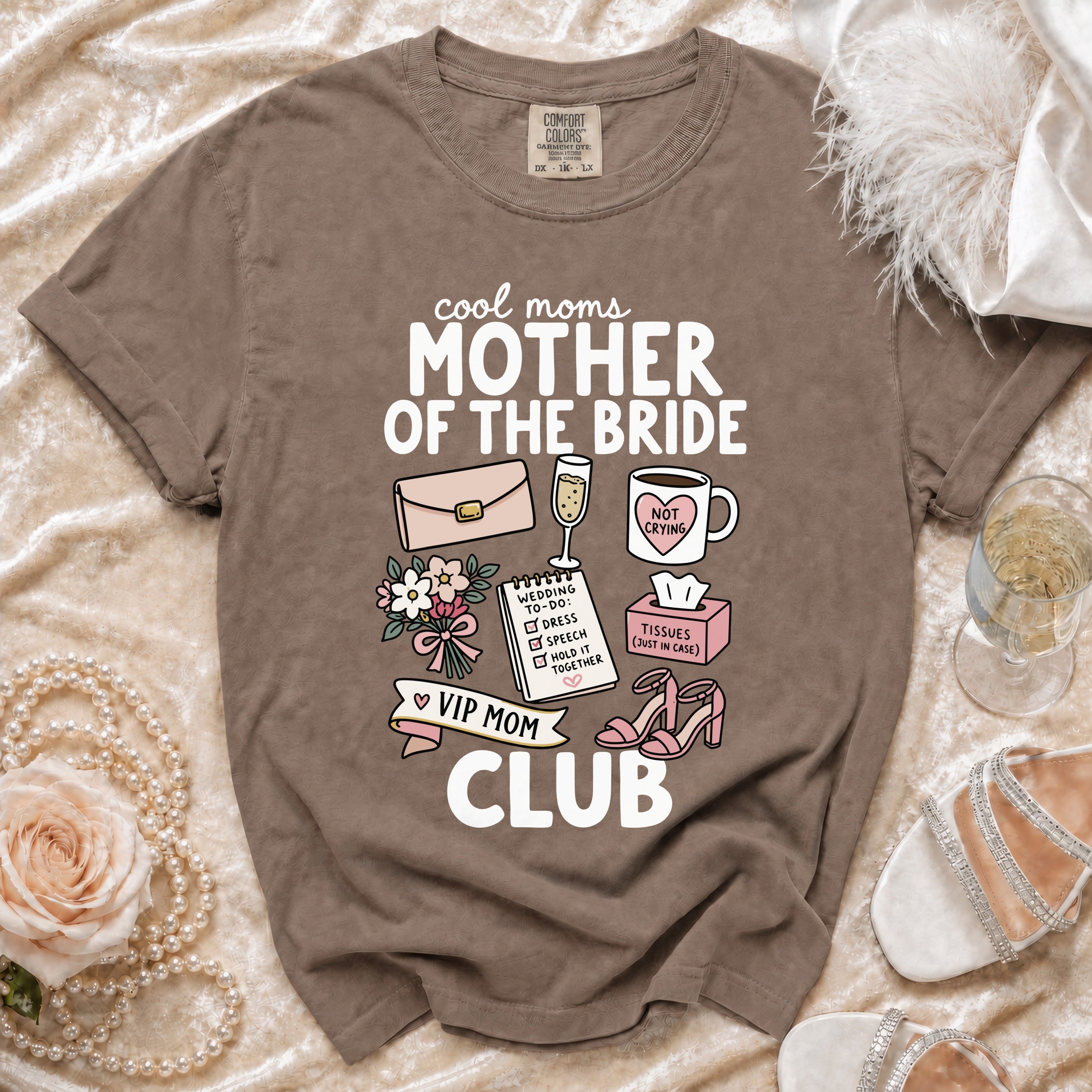 Brown t-shirt with "Cool Moms Mother of the Bride VIP Mom Club" text and wedding icons.