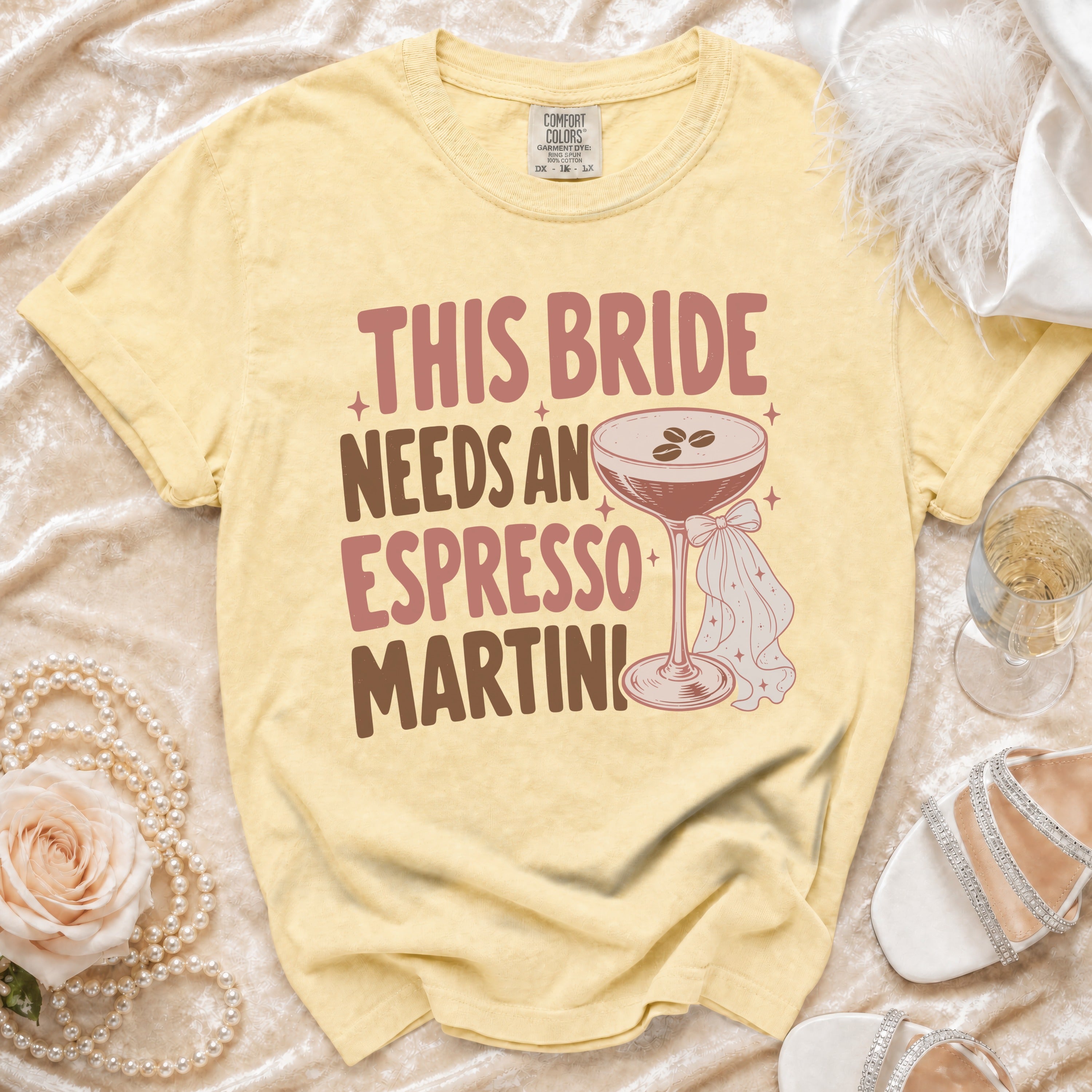 Yellow t-shirt with text This Bride Needs An Espresso Martini and cocktail graphic.