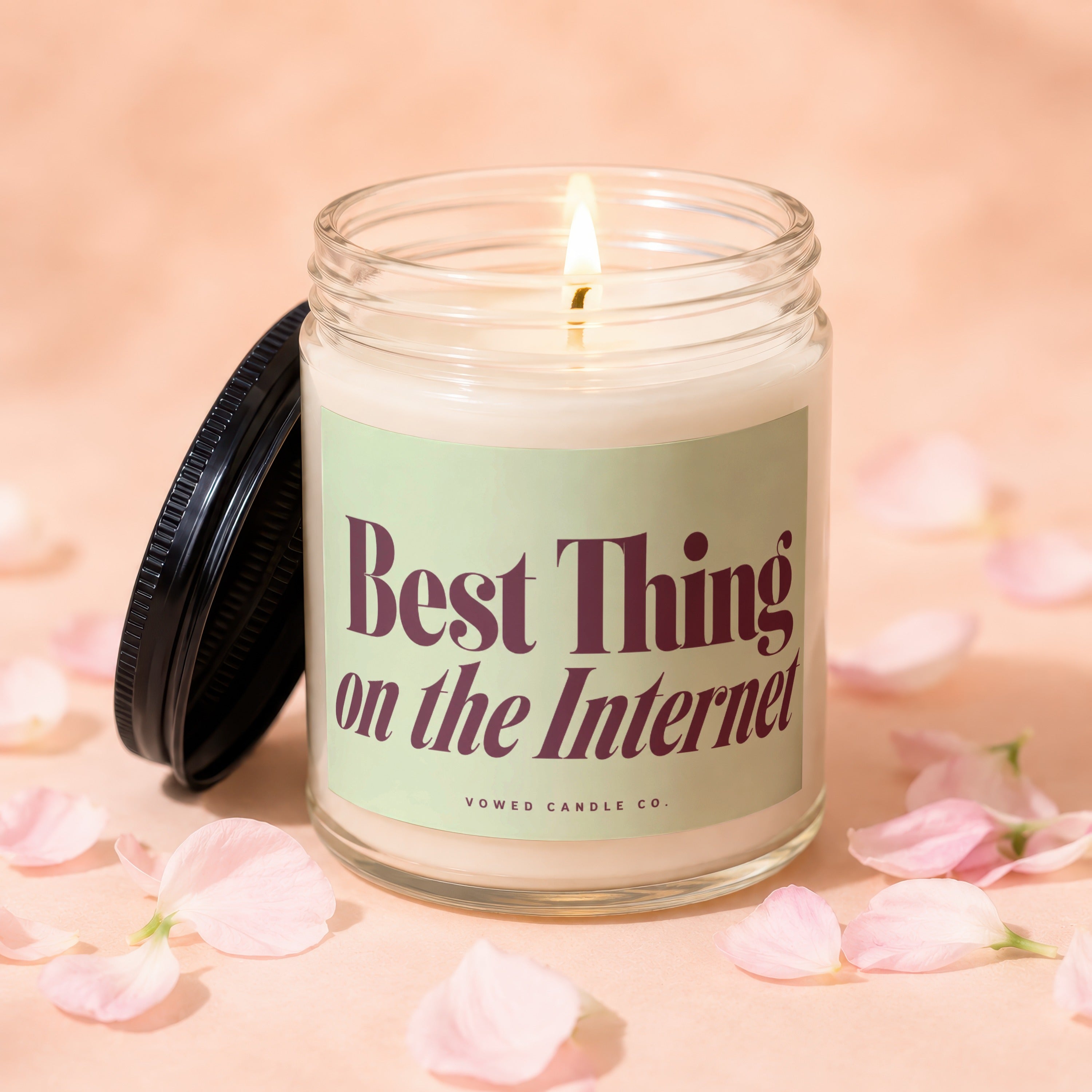 Glass candle with 'Best Thing on the Internet' text and 'Vowed Candle Co.'