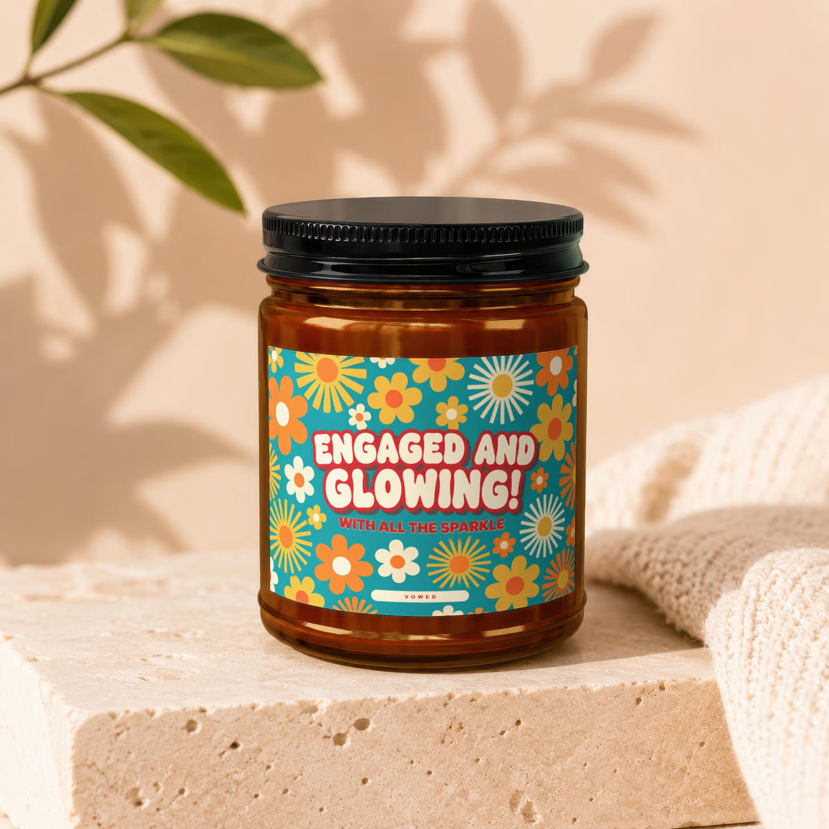 Glass jar with "Engaged and Glowing! With All The Sparkle" text and floral pattern.