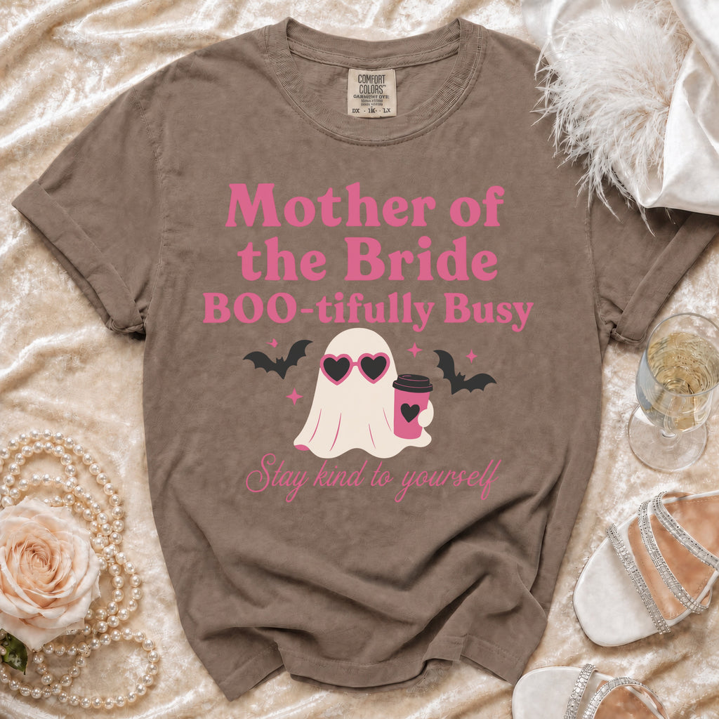Brown Comfort Colors t-shirt with pink "Mother of the Bride BOO-tifully Busy" text and ghost graphic.