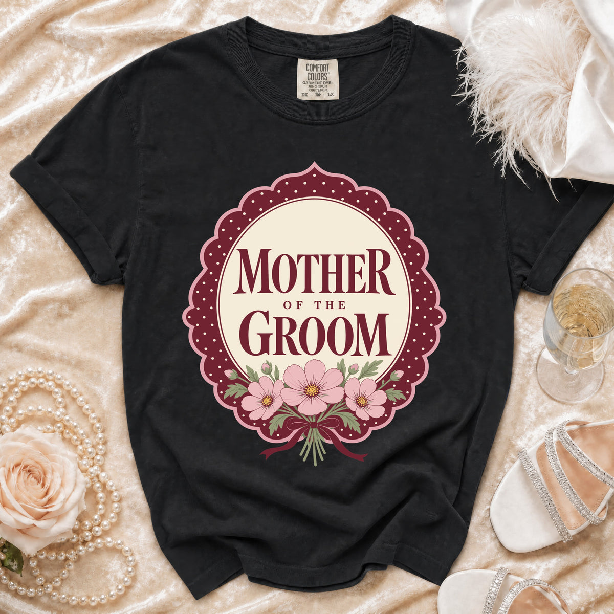 Black t-shirt with "Mother of the Groom" text and floral design.
