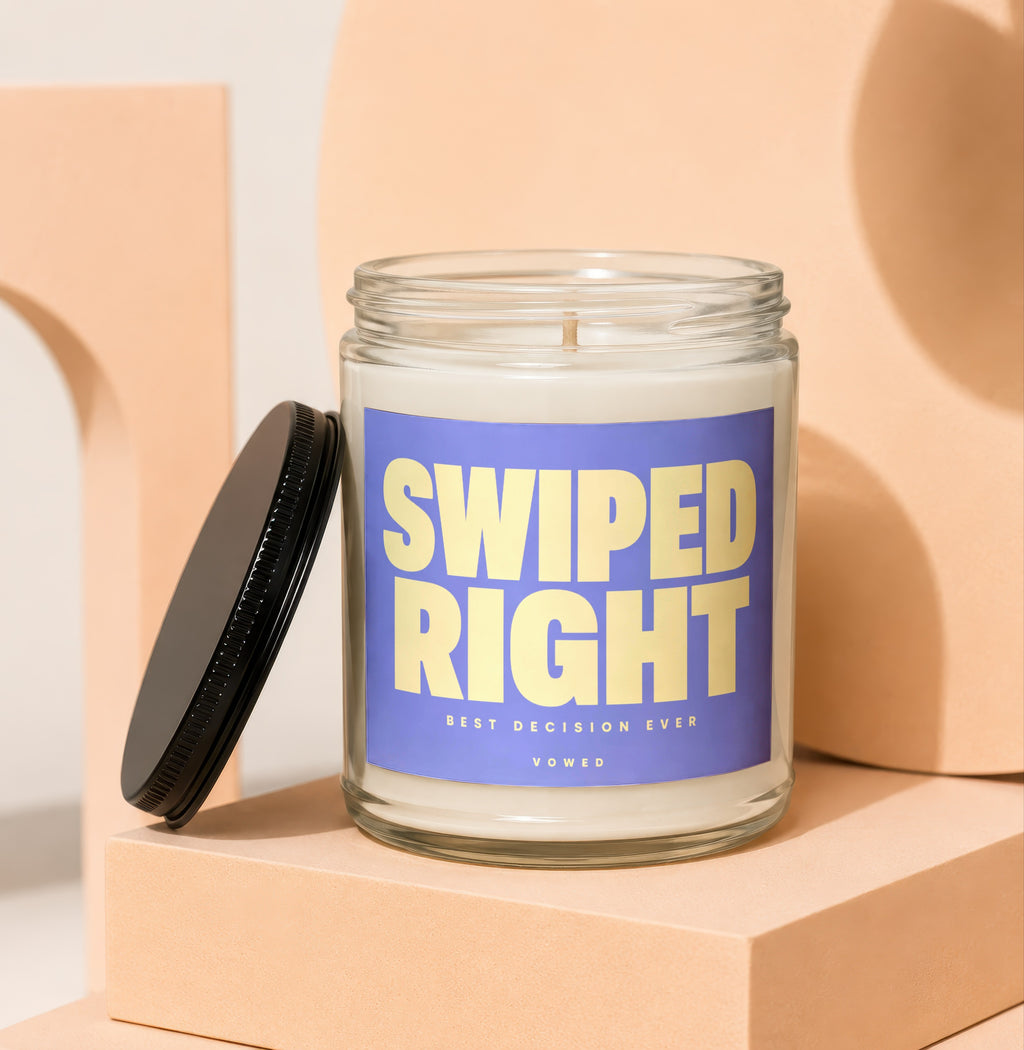 Scented candle with text "SWIPED RIGHT BEST DECISION EVER VOWED" on label.