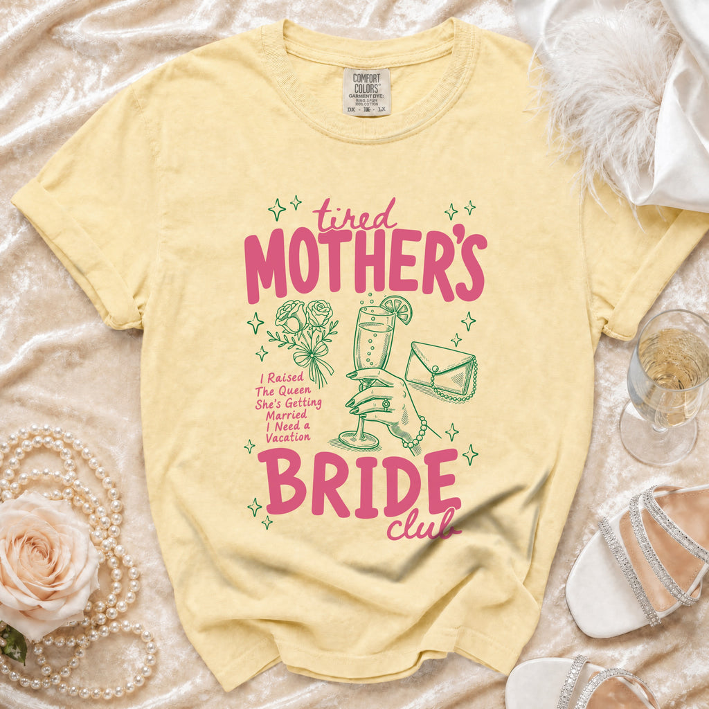 Yellow t-shirt with "Tired Mother's Bride Club" graphic and bridal accessories.