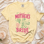 Yellow t-shirt with "Tired Mother's Bride Club" graphic and bridal accessories.