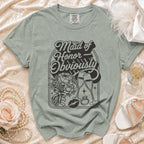 Maid of Honor Obviously t-shirt with floral bouquet, champagne glasses, lipstick, and ring graphic.