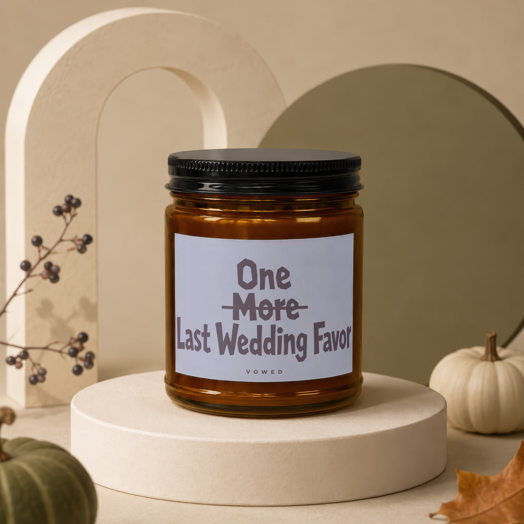 Amber candle with black lid featuring text "One More Last Wedding Favor Vowed".