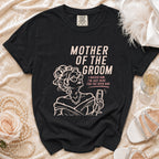 Black t-shirt with "Mother of the Groom" and humorous quote, featuring a sketched woman with champagne.