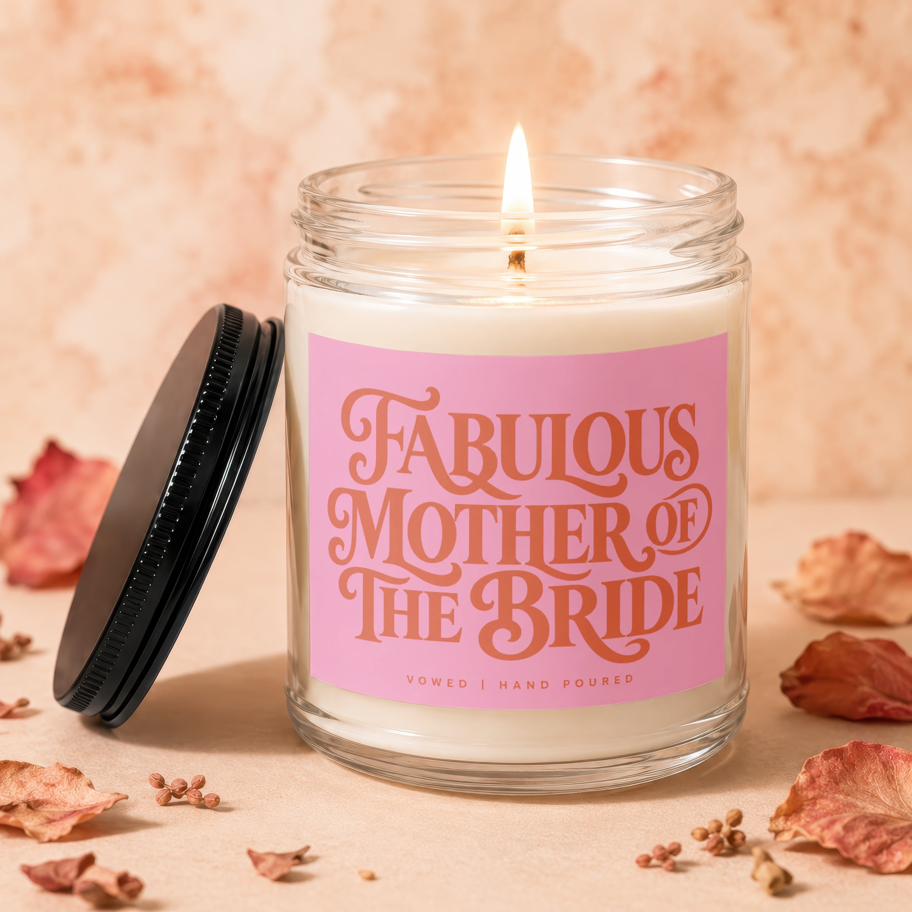 Candle with "Fabulous Mother of the Bride" text on a pink label.