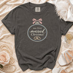 Dark grey t-shirt with "our first married Christmas" text and rings design.