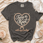 Gray t-shirt with "Tying the Knot with my Cowboy" text in a heart.