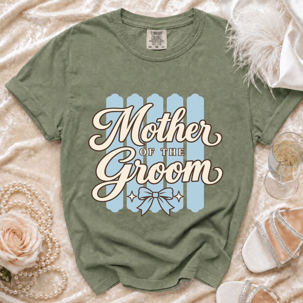 Green t-shirt with "Mother OF THE Groom" text and a bow graphic.