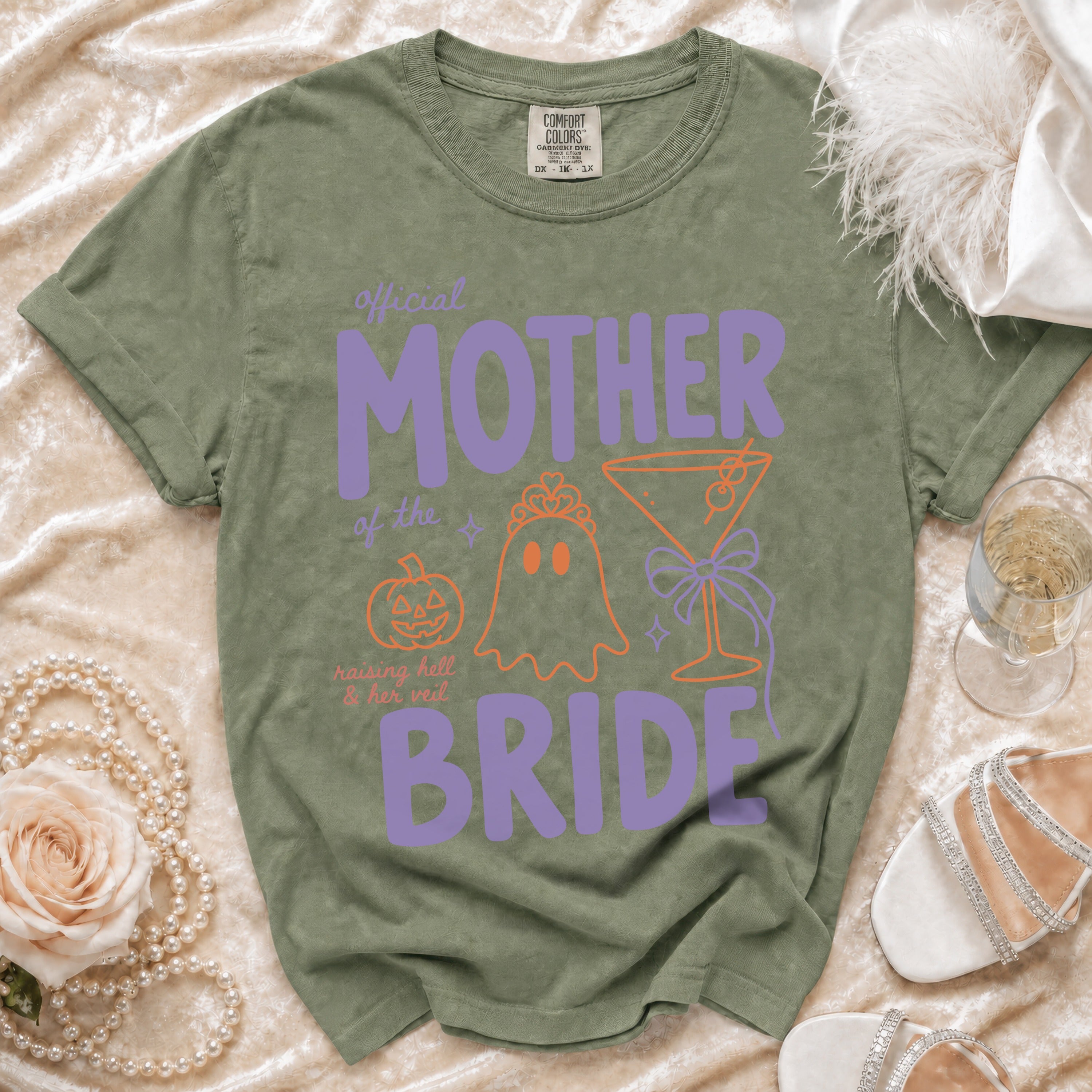 Green t-shirt with "Official Mother of the Bride" text and Halloween graphics.