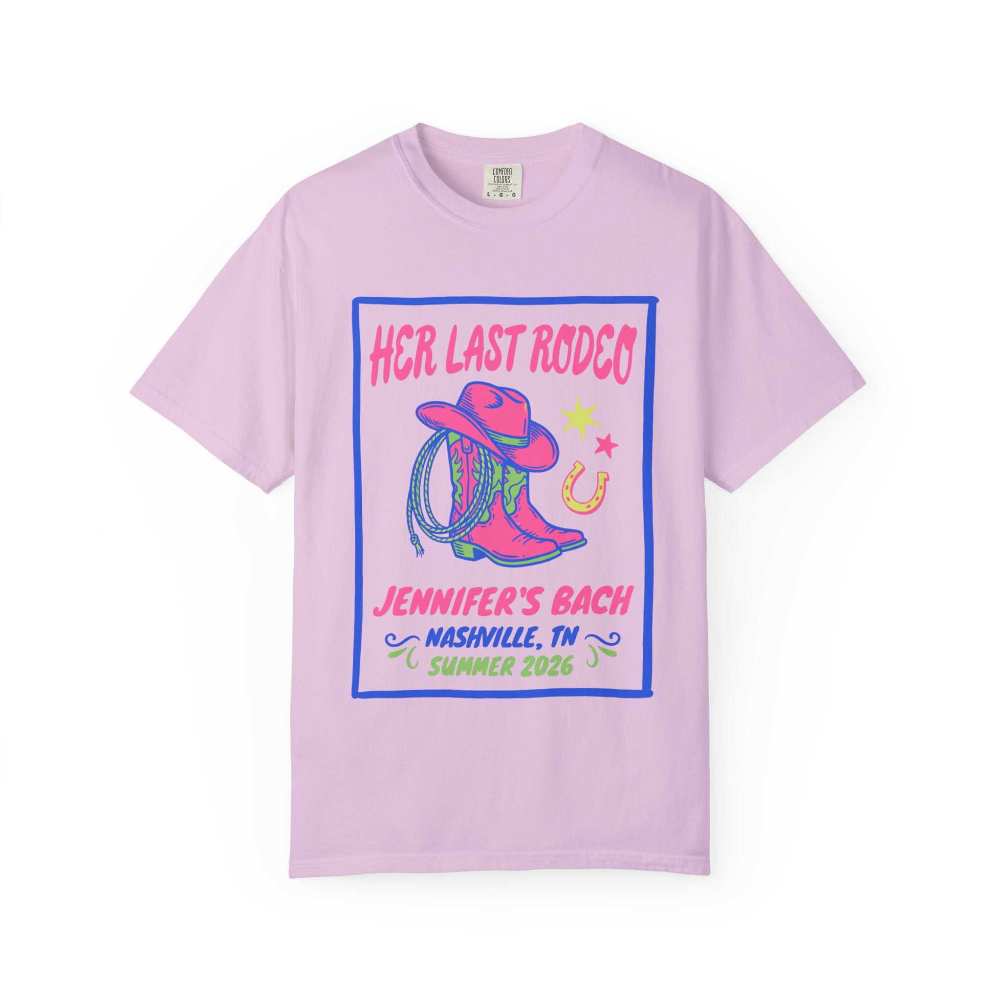 Pink t-shirt with "Her Last Rodeo" text, cowboy boots, and horseshoe graphic.