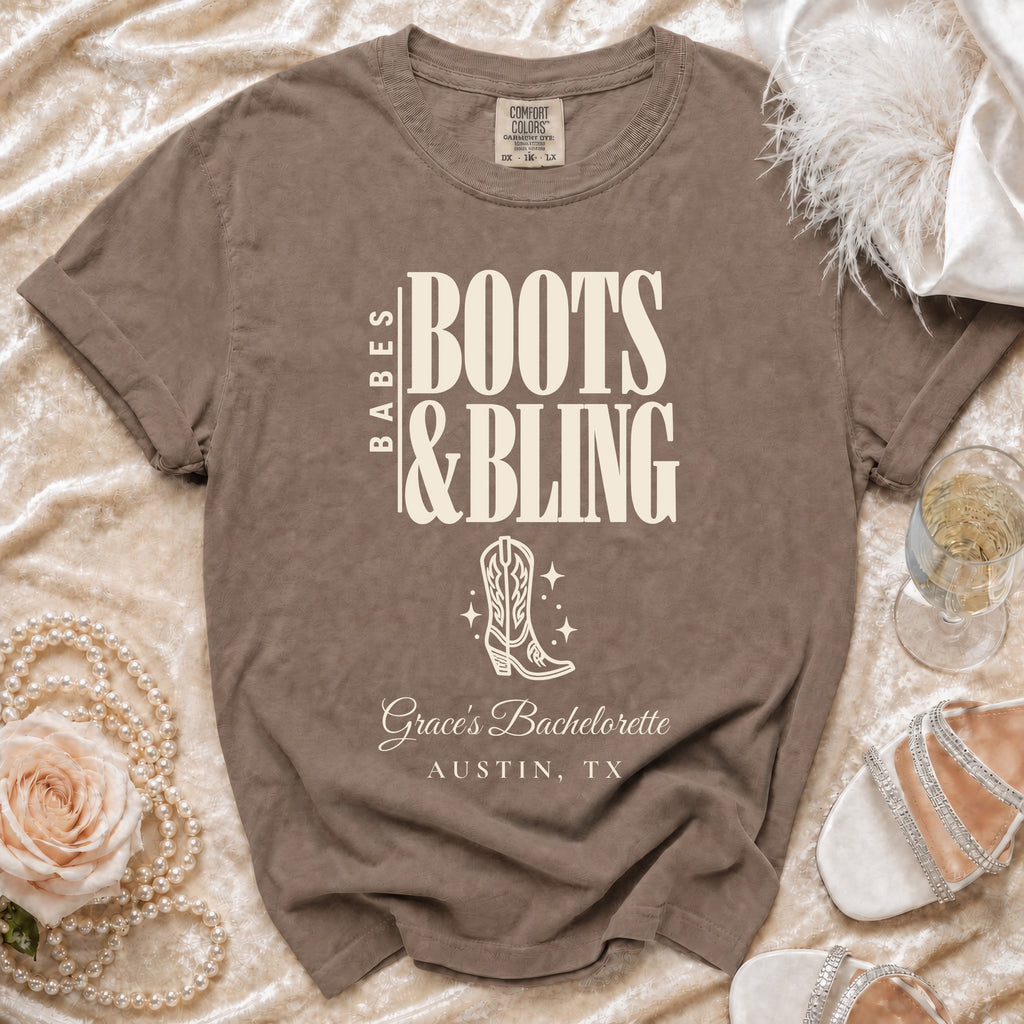 Brown t-shirt featuring the text "Babes Boots & Bling Grace's Bachelorette Austin, TX" and a cowboy boot graphic.