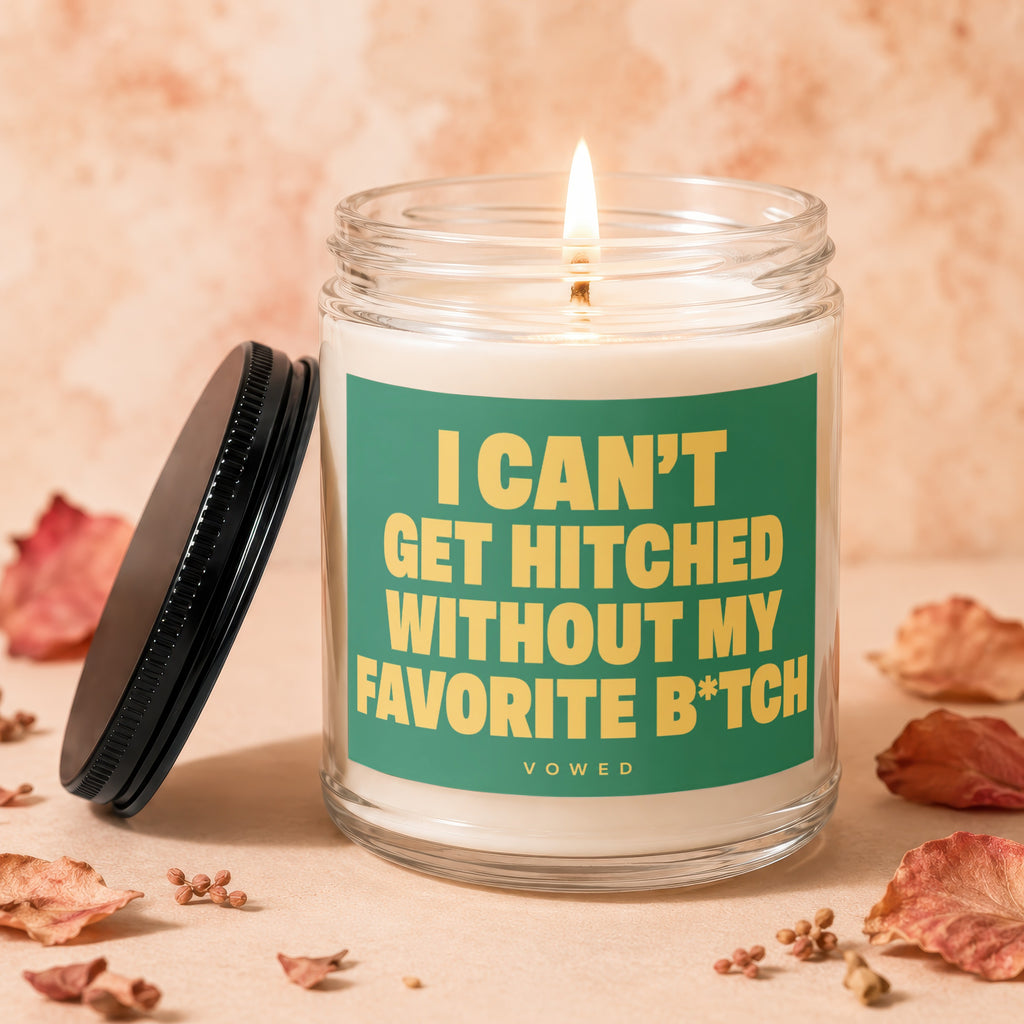 Lit candle in glass jar with green label "I CAN'T GET HITCHED WITHOUT MY FAVORITE B*TCH"