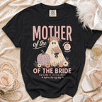 Black t-shirt with "Mother of the Bride" ghost, pumpkin, and floral graphic.
