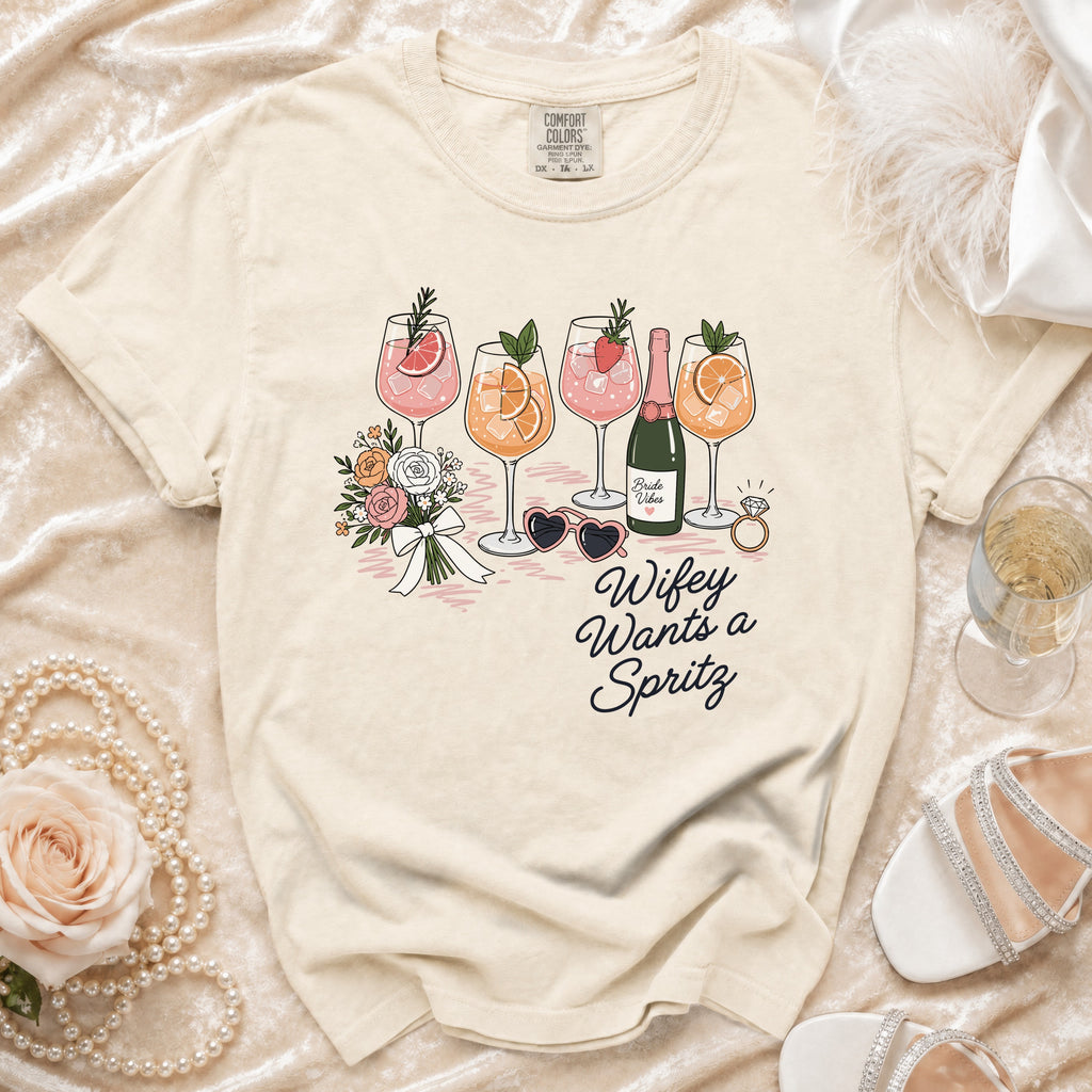 Cream t-shirt with "Wifey Wants a Spritz" and cocktail graphic.