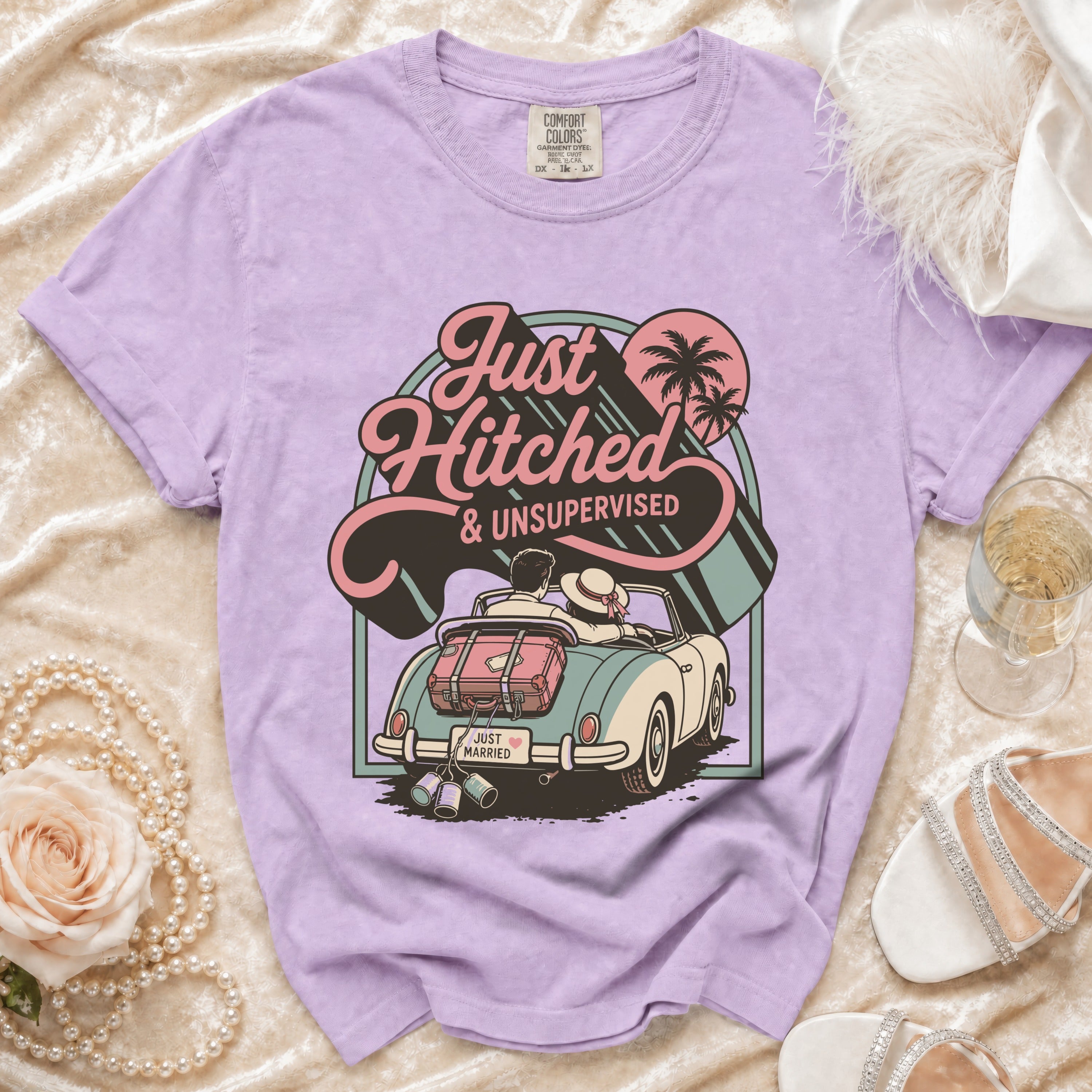 Lavender t-shirt with "Just Hitched & Unsupervised" graphic of a couple in a convertible.