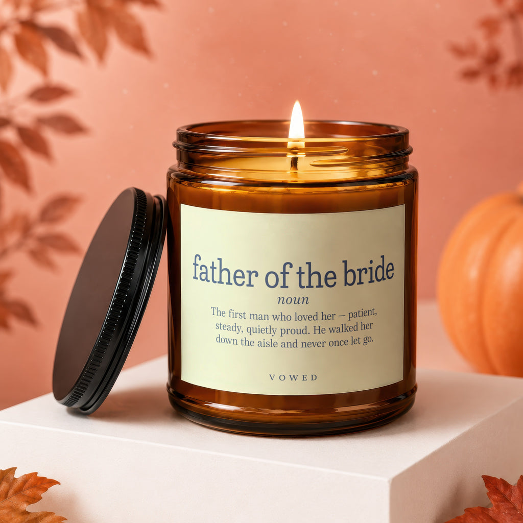 Candle with "father of the bride" definition and a lit wick.