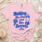 Pink t-shirt with "Holding Her Dress and Her Secrets" text and bridal graphics.