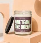 Glass candle with lid off shows text "ONE TEAM, ONE DREAM".