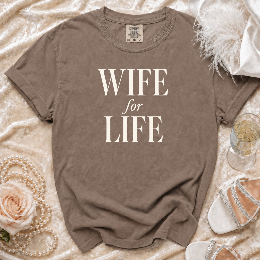 Brown t-shirt with "WIFE for LIFE" text, laid flat with accessories.