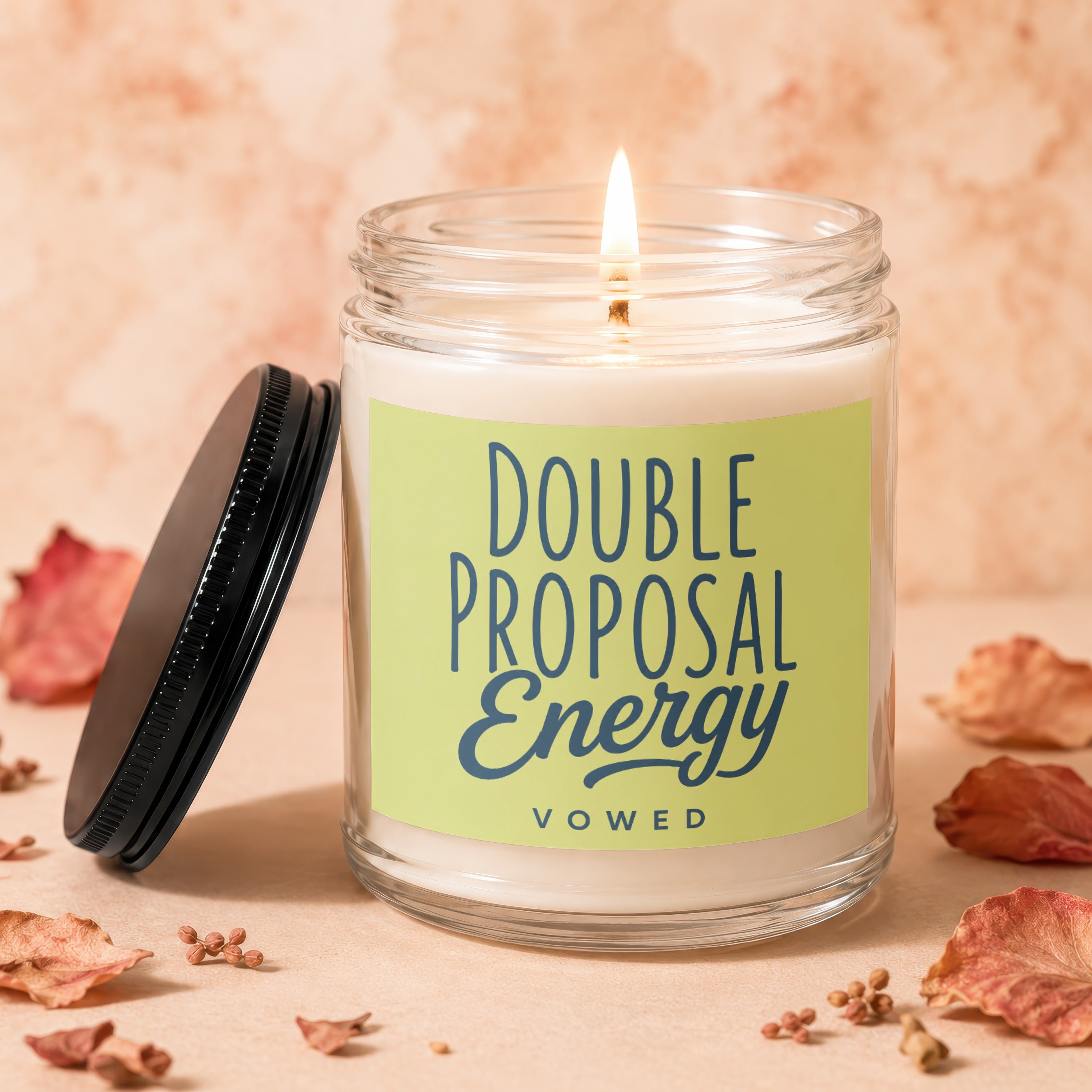 Jar candle with lit wick, showing a lime green label with text "Double Proposal Energy Vowed".