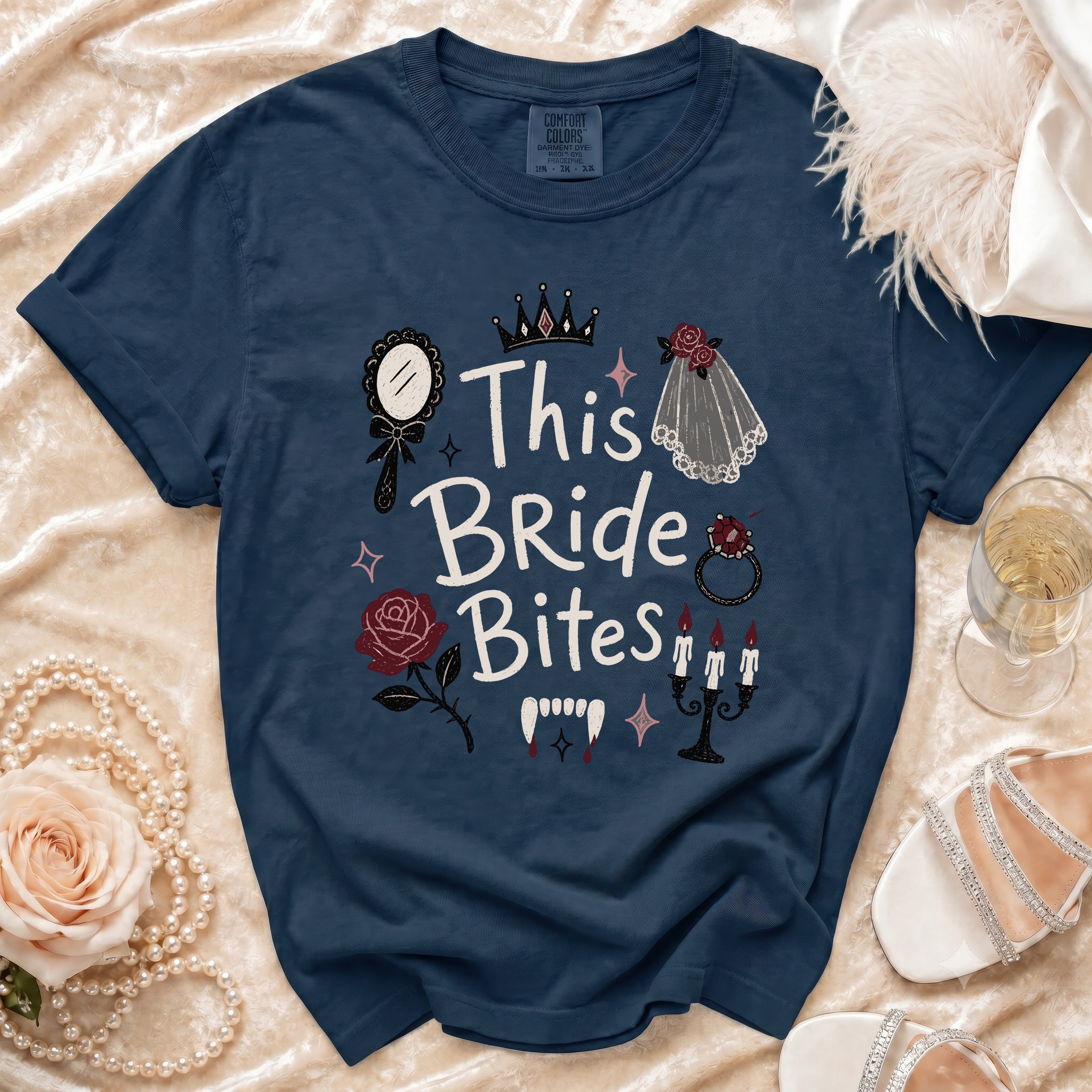 Navy t-shirt with "This Bride Bites" graphic and gothic bridal accents.