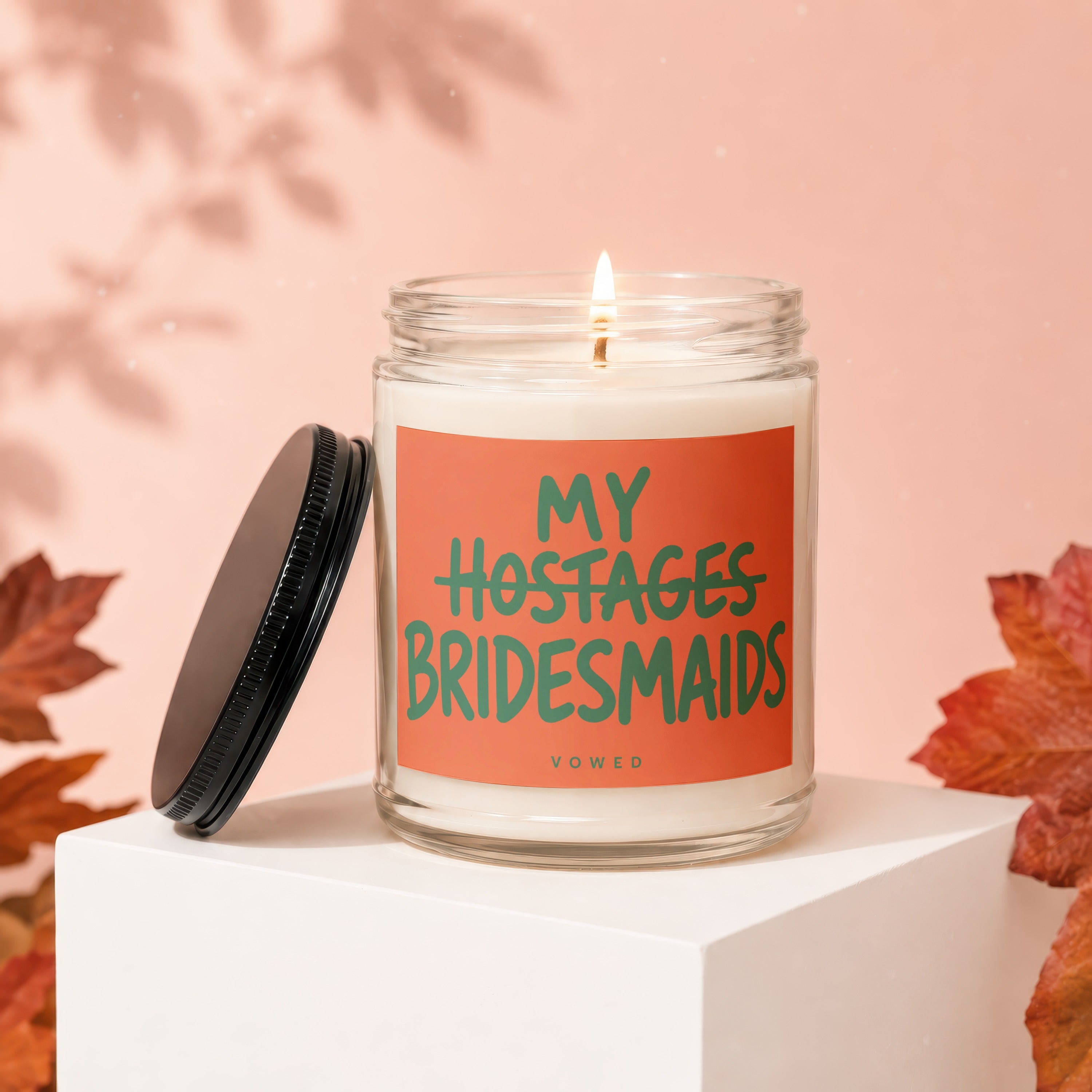 Candle with text "My Hostages Bridesmaids" and "VOWED".