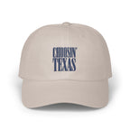 Light beige baseball cap featuring embroidered blue text on the front that reads CHOOSIN TEXAS.