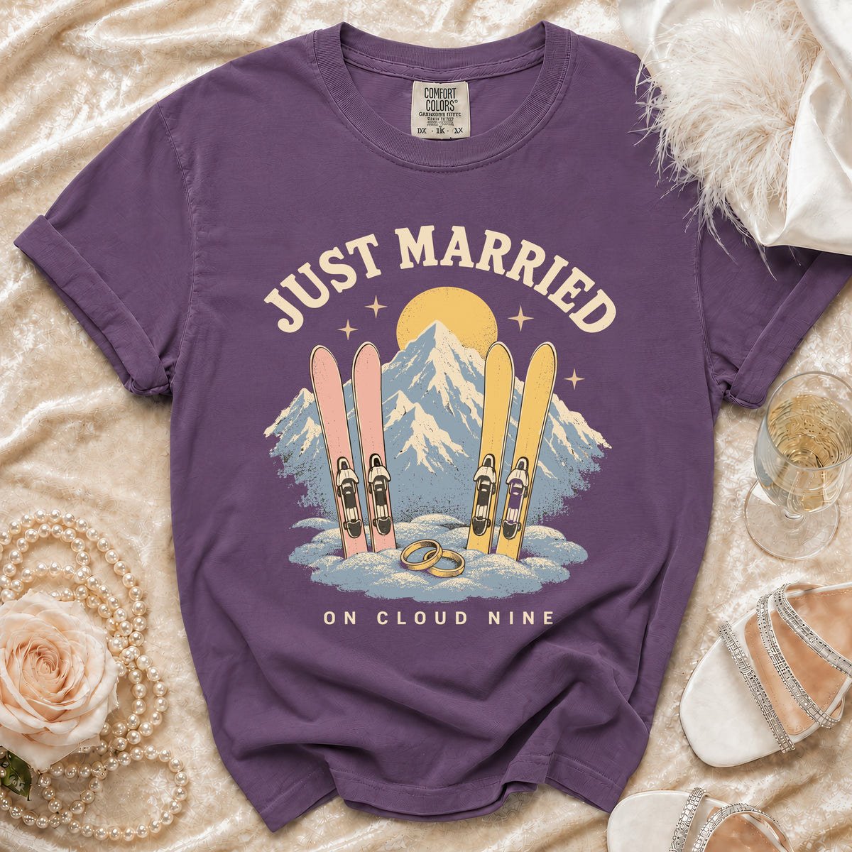 Purple t-shirt with "Just Married On Cloud Nine" text and ski graphic.