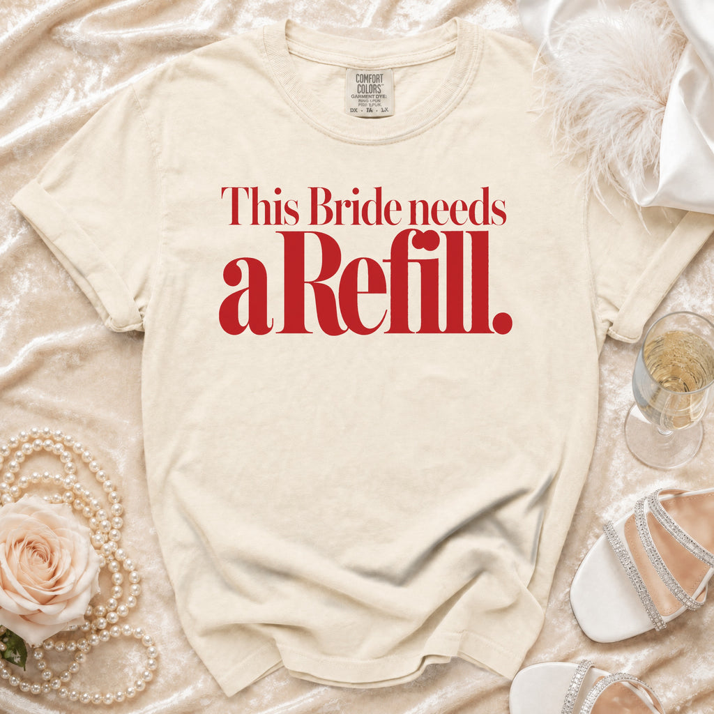 Cream t-shirt with red text "This Bride needs a Refill."