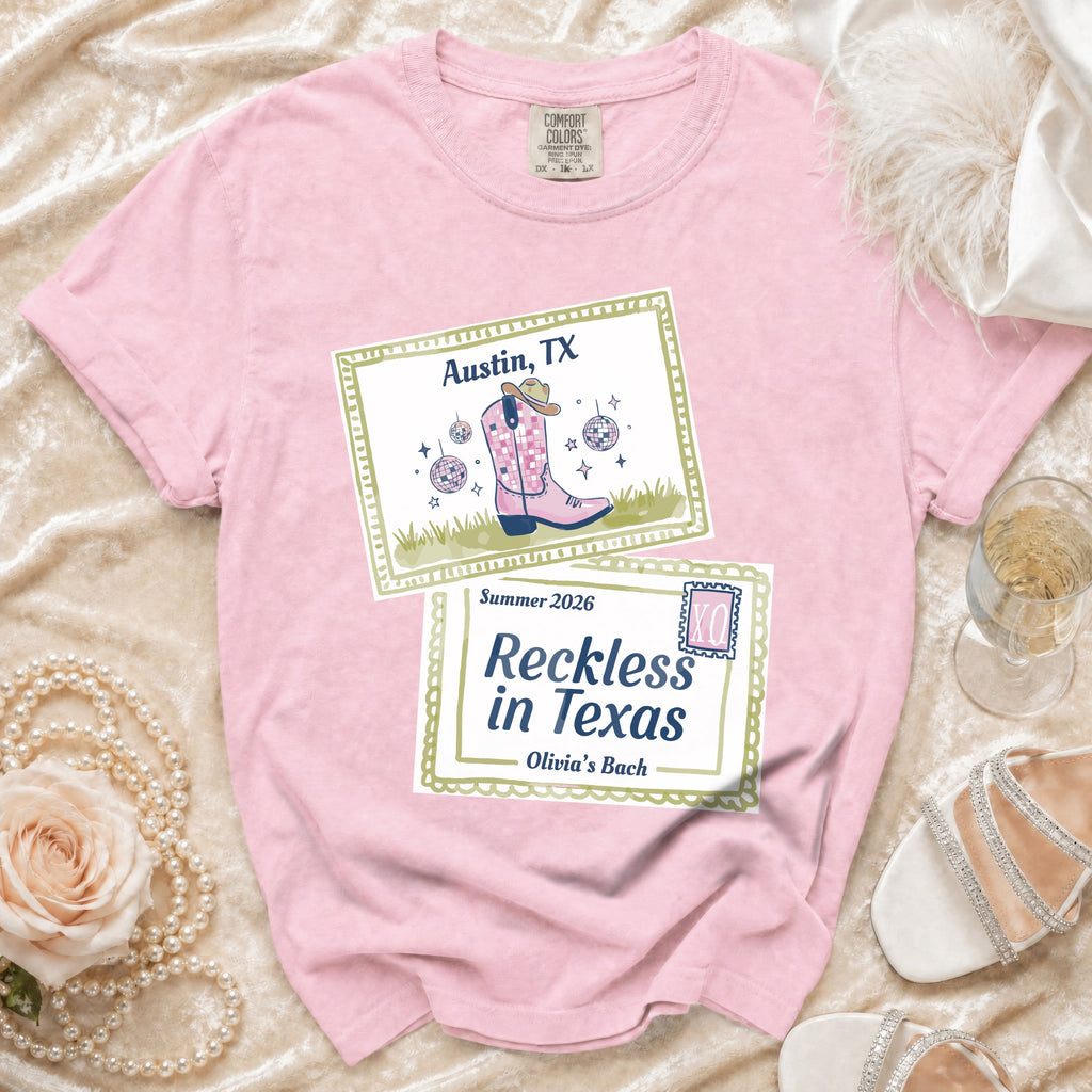 Pink t-shirt with Austin, TX and Reckless in Texas graphics.