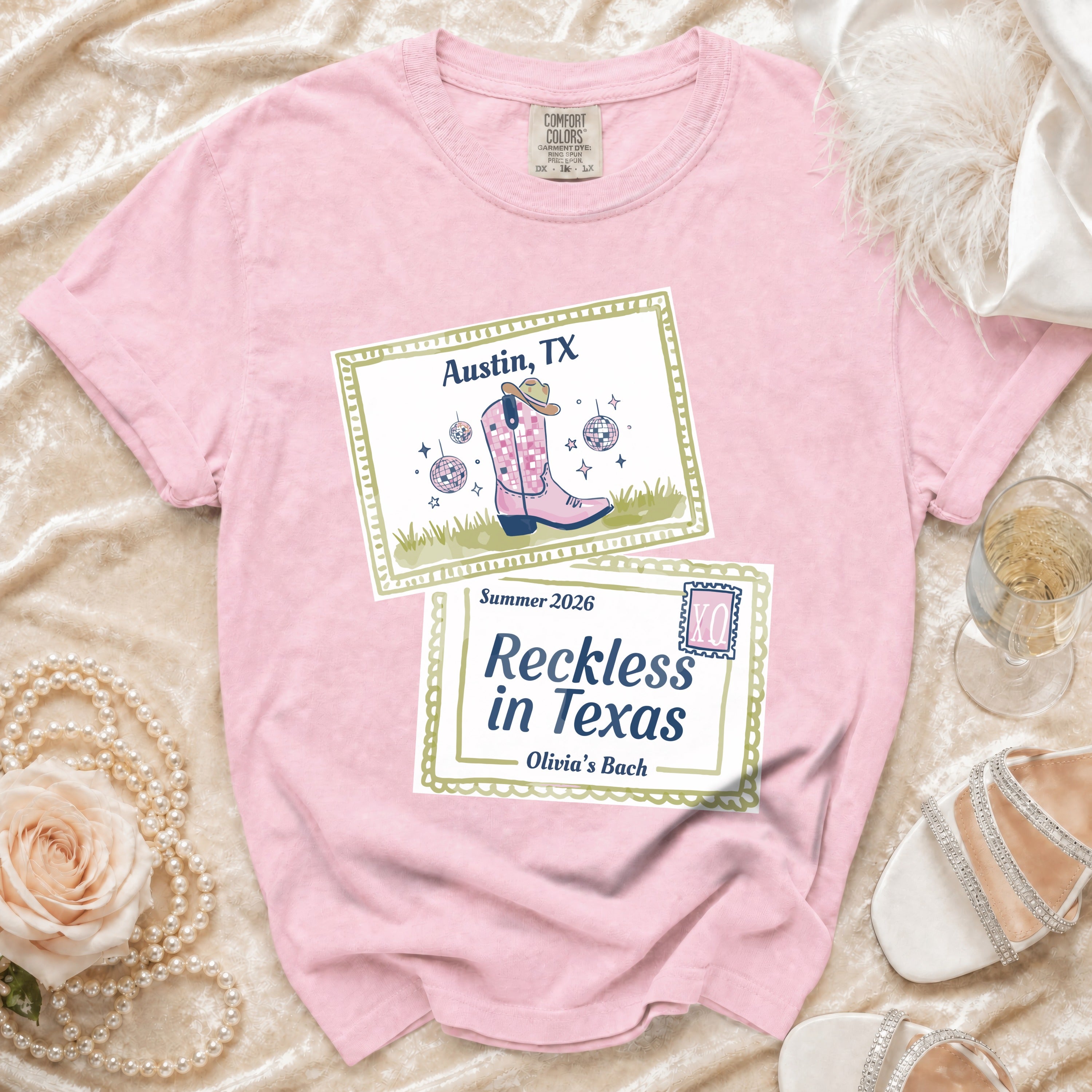 Pink t-shirt with Austin, TX and Reckless in Texas graphics.