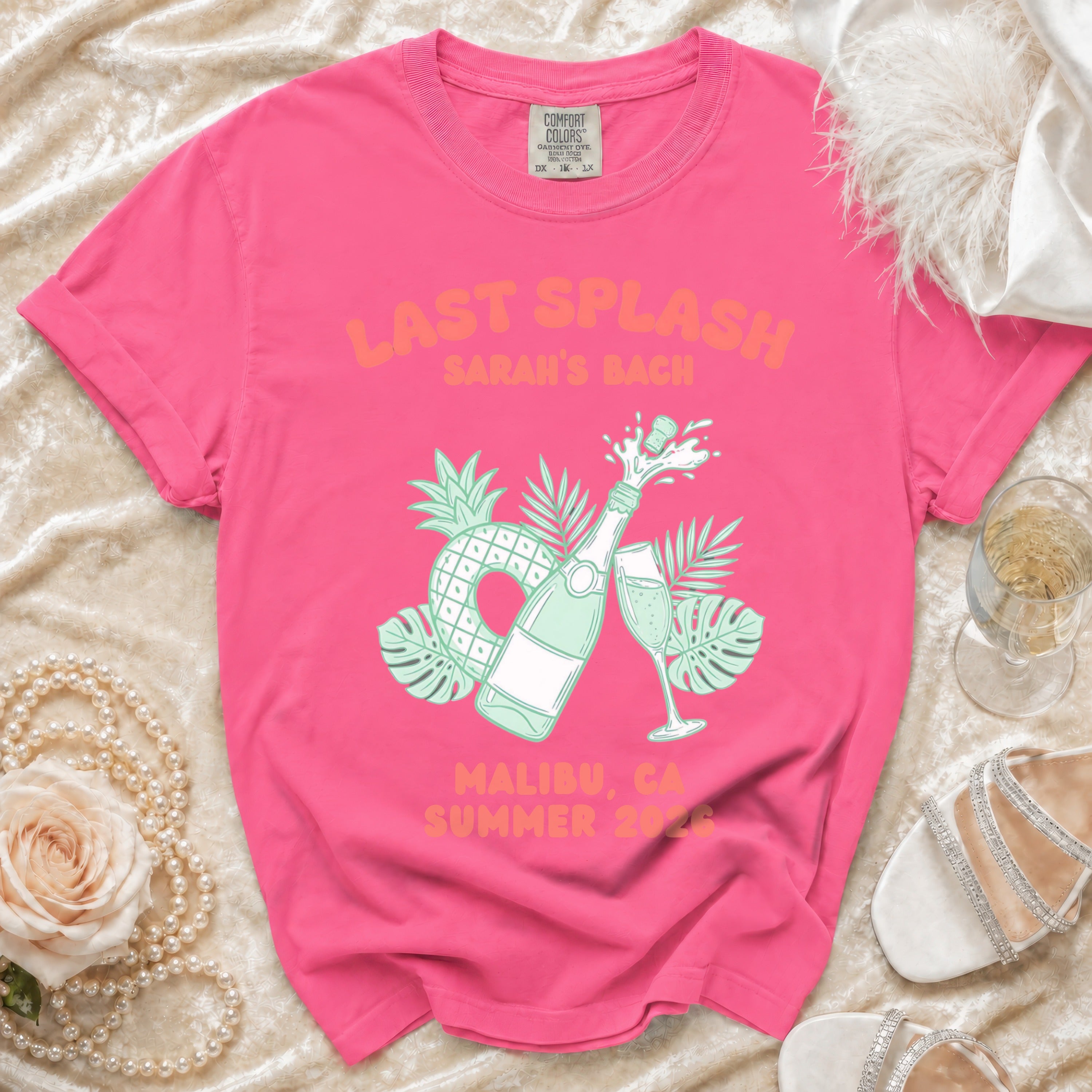 Pink t-shirt with "Last Splash Sarah's Bach Malibu, CA Summer 2026" text and graphics.