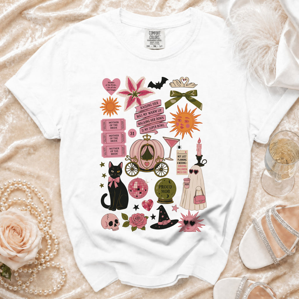 White t-shirt graphic with a pink pumpkin carriage, black cat, and "Proud Mob" orb.