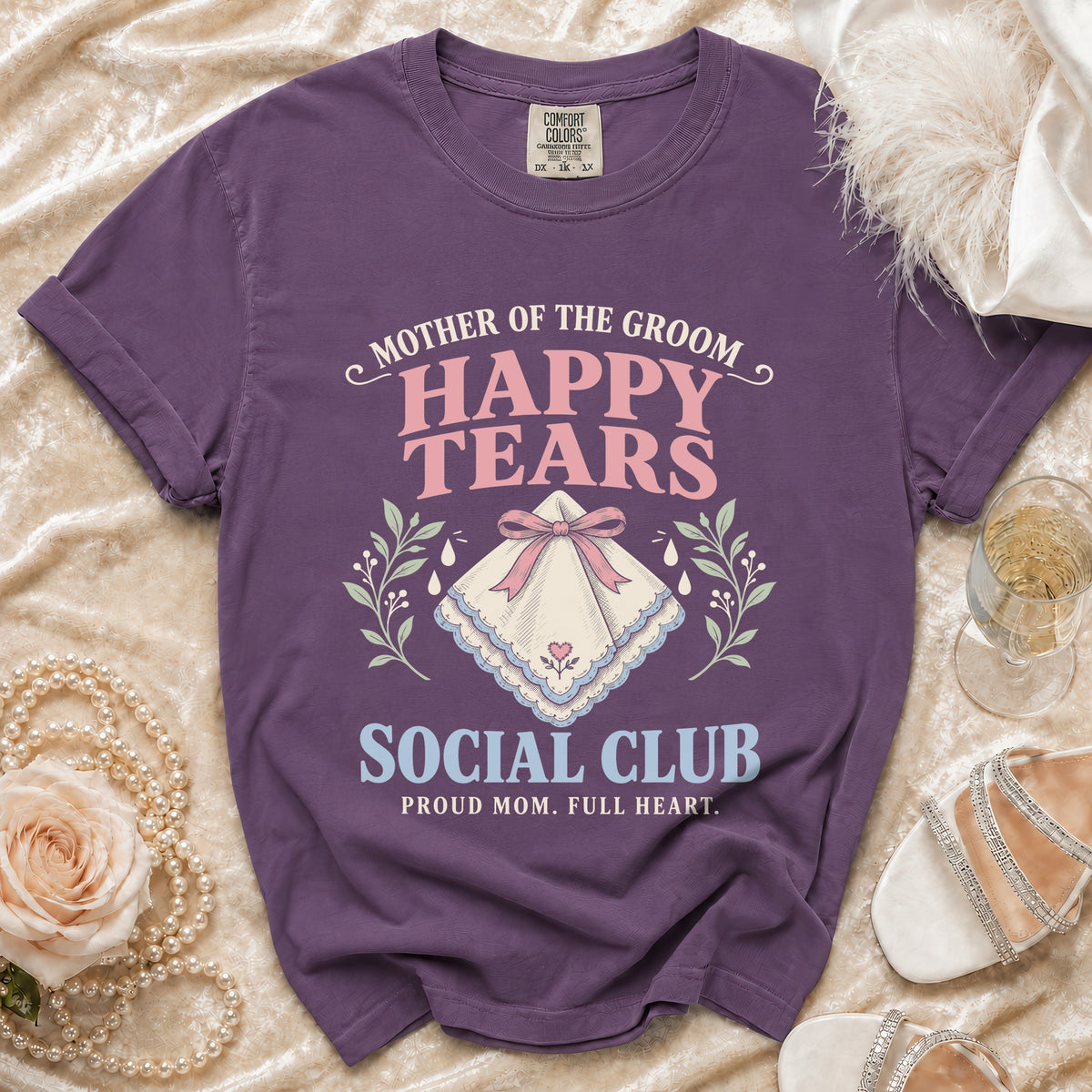 Purple t-shirt with "Mother of the Groom Happy Tears Social Club" text and a handkerchief graphic.