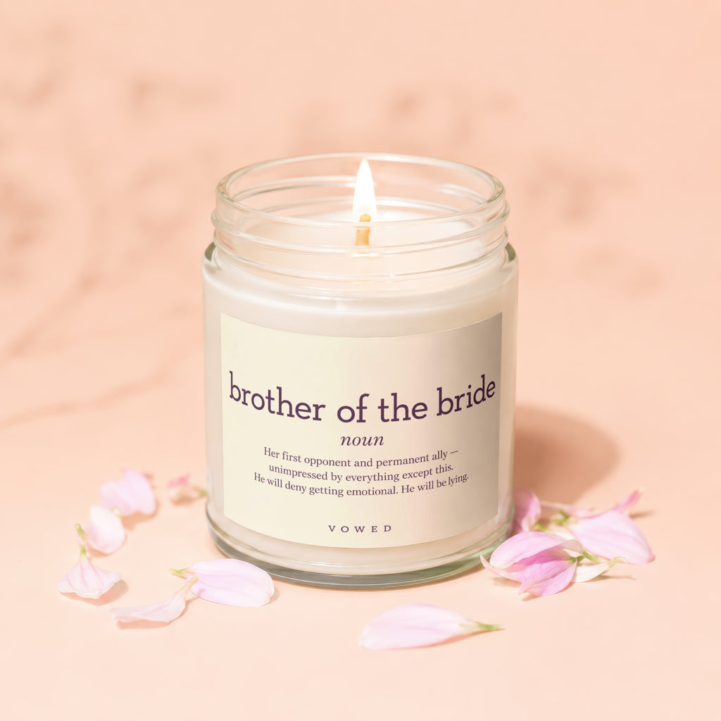 Candle with text "brother of the bride noun" and a humorous definition.