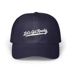 Dark blue baseball cap featuring white embroidered text reading Let's Get Rowdy across the front.
