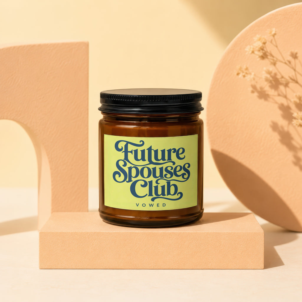 Amber jar candle with a light green label that reads "Future Spouses Club VOWED".