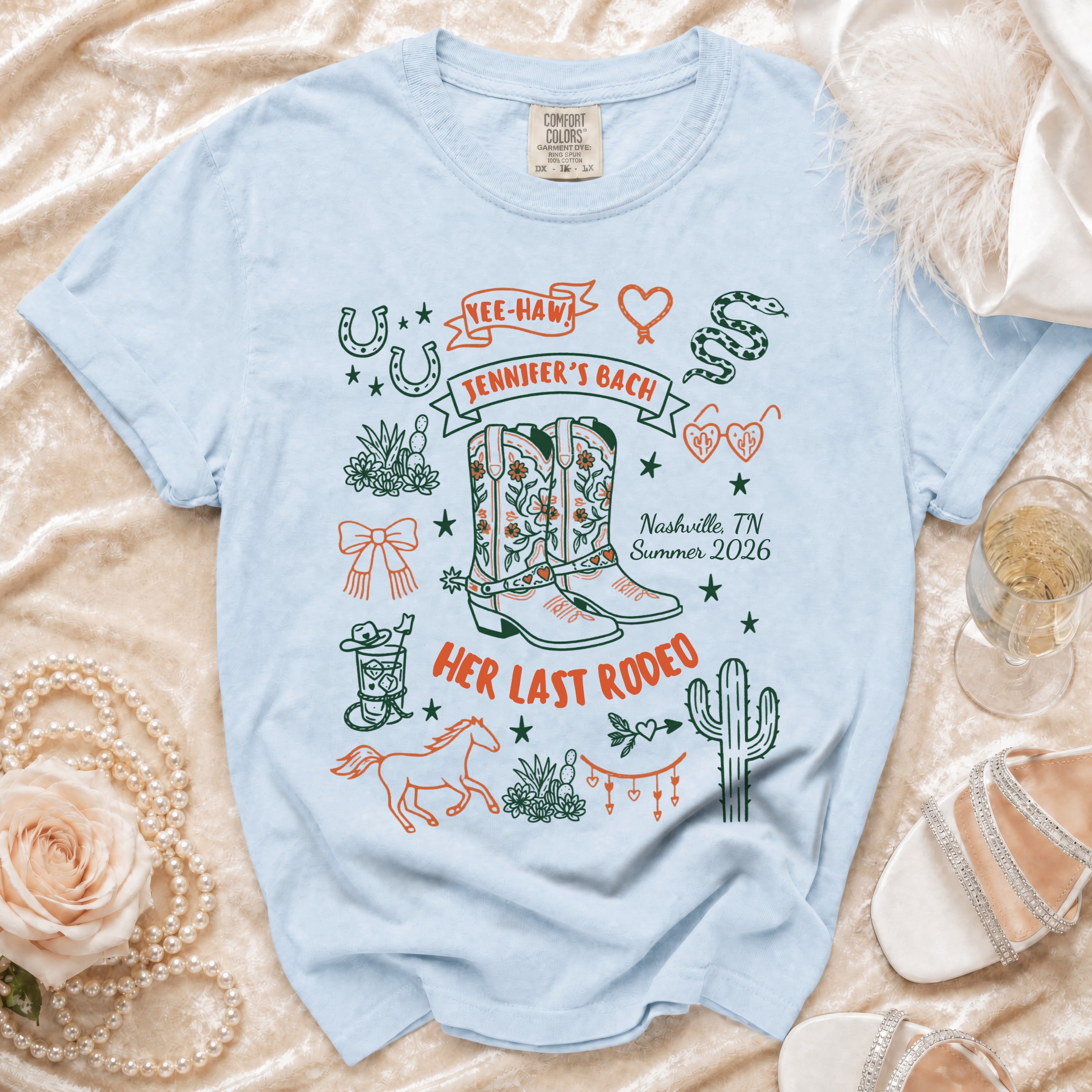Light blue t-shirt with "Yee-Haw Jennifer's Bach Her Last Rodeo Nashville, TN Summer 2026" design.