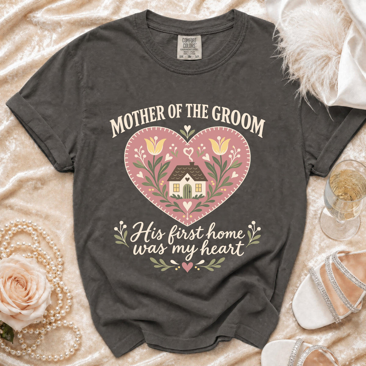 Mother of the Groom t-shirt with heart graphic and text "His first home was my heart."
